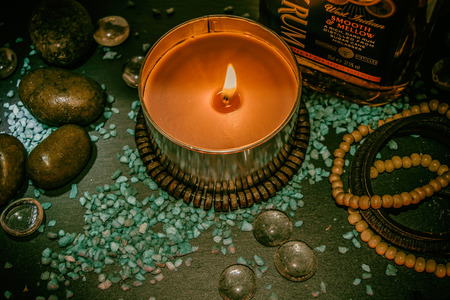 Pubbles sand s stones bracelets dark rum & flame of candleの写真素材