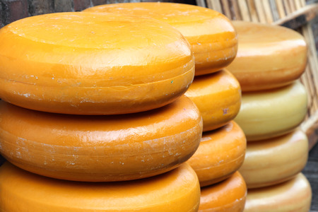 Pile of Gouda cheese offloaded on a quay in Gouda harbor on the occasion of the annual Harbor Days,...