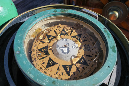 ANTARCTIC PENINSULA, ANTARCTICA - FEBRUARY 2, 2011: Historical compass on board of the bark Europa, a tourist tallship sailing the world. Trademark Decca Copenhagen, type 41B90.のeditorial素材
