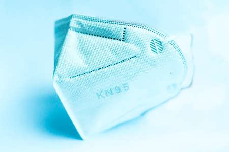 Blue mask for protection against viruses and bacteria with white background