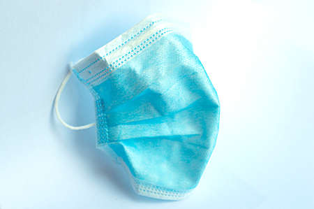 Blue mask for protection against viruses and bacteria with white background