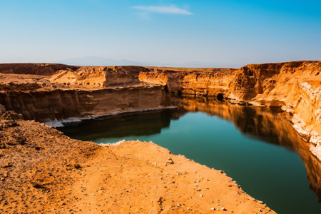 The desert landscape, a realm of arid beauty, unfolds as a vast and timeless tapestry of muted colors, undulating dunes, and dramatic vistas. Nature's resilient spirit is on display in this seemingly harsh environment, where the scarcity of water has shaped a unique and captivating terrain.の素材