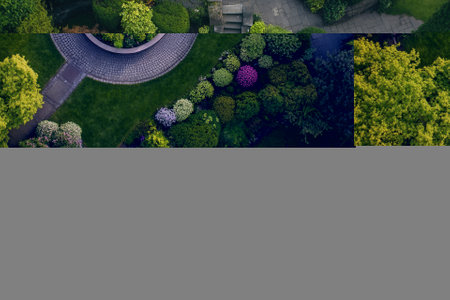 Aerial view of a circular garden with a fountain.の素材