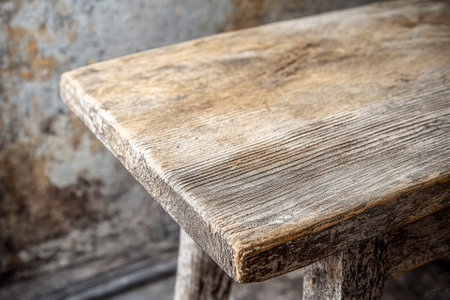Close-up of a rustic wooden table surface.の素材
