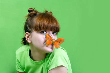 Young girl  with  butterflyの写真素材