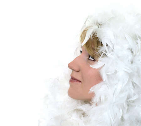Profile Portrait of a girl with white feathers on whiteの写真素材