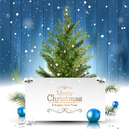 Christmas greeting card with Christmas tree on wooden background