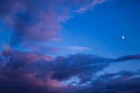 Moon and blue skyの写真素材