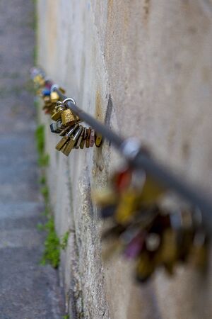 Padlocks hanging on a banister in Paris