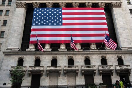 Wall street New York Stock Exchange with American flag
