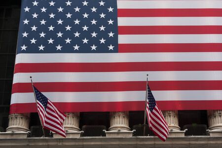 Wall street New York Stock Exchange with American flagのeditorial素材