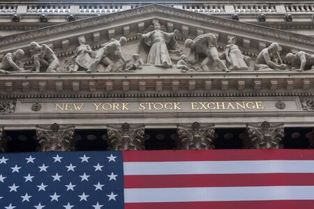 Wall street New York Stock Exchange with American flagのeditorial素材