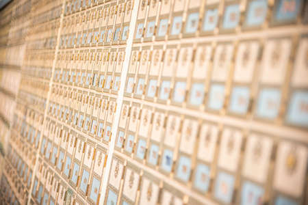 Rows of mid-century modern design post office mailboxes in brass metal.の写真素材