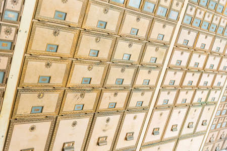 Rows of mid-century modern design post office mailboxes in brass metal.の写真素材