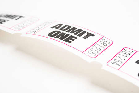 A macro or close-up shot of a strip of generic white sequentially numbered admittance paper ticket.の写真素材