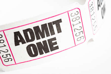 A macro or close-up shot of a strip of generic white sequentially numbered admittance paper ticket.