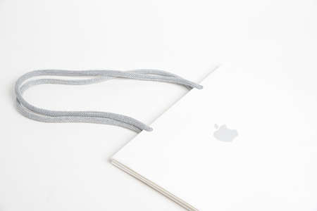 Vidalia, Georgia, USA / June 29, 2019: A close-up product studio shot of Apple retail storeâs medium size white paper bag set on white background.のeditorial素材