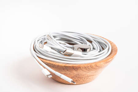 Vidalia, Georgia / USA - September 8, 2019: Several white Apple power cables and connectors swirling...