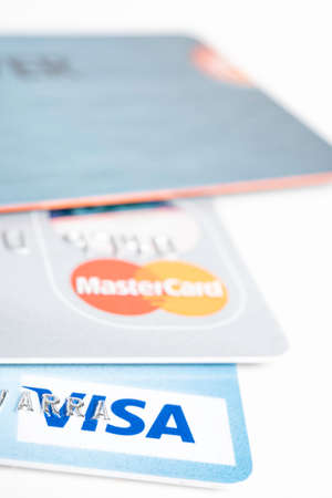 Vidalia, Georgia / USA - September 16, 2019: A an extreme close-up with selective focus of portions of several plastic credit cards set on light color background.のeditorial素材