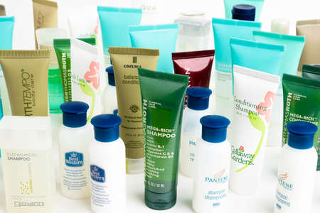 Vidalia, Georgia / USA - July 6, 2019: A set of branded shampoos, conditioners, lotions, and all other potions in small bottles from different hotels.のeditorial素材