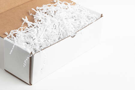 A close-up studio shot of a generic open white packaging box set on a plain white background.
