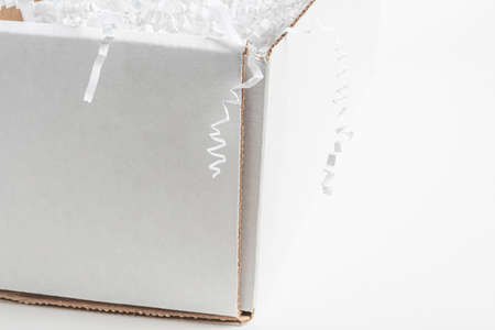 A close-up studio shot of a generic open white packaging box set on a plain white background.
