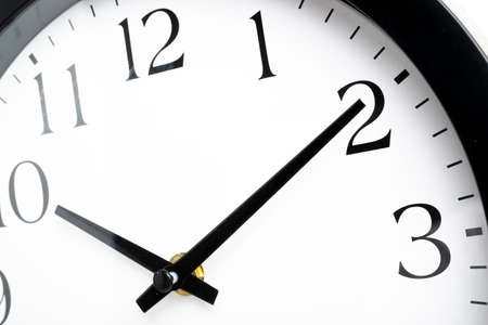 A creative macro shot of the face of an old, dirty, broken, and discarded plastic wall clock.の写真素材