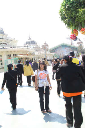 EVERLAND, YONGIN, KOREA - APRIL 06 : The unidentified group of tourists are queuing and be happy at the entrance way on april  06, 2011 at Everland, Yongin, Korea.のeditorial素材