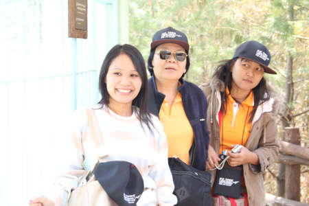 EVERLAND, YONGIN, KOREA - APRIL 06 : The unidentified  women are acting to camera with their tourist  on april 06, 2011 at Everland, Yongin, Korea.のeditorial素材