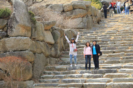 WAUJEONGSA TEMPLE,SUWON,KOREA-APRIL 07:The unidentified tourists are travelling and Temple to see the beauty of the economic treatment of the large and worship God. on april 07, 2011 at waujeongsa temple, suwon, Korea. のeditorial素材