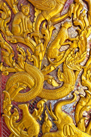 Buddhist decoration on a door in a temple の写真素材