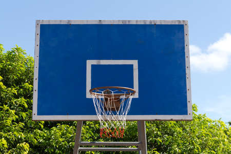 Basketball goal net on blue skyの写真素材