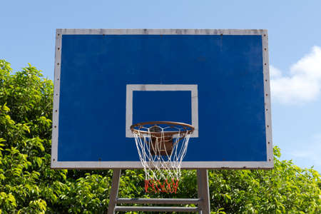 Basketball goal net on blue skyの写真素材