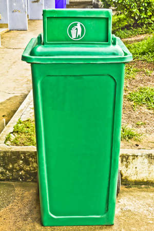 Green garbage bin with wheelsの写真素材