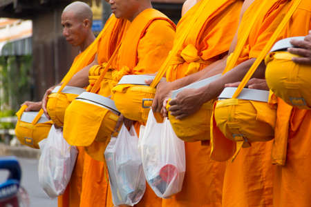 Give Food Offerings To a Buddhist Monk Of Thailandのeditorial素材