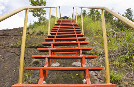 Red steel ladder up the mountainの写真素材
