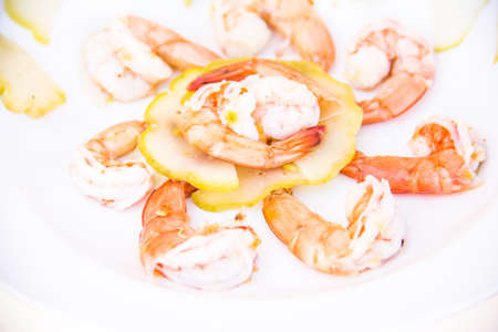 shrimps in sauce on the plateの写真素材