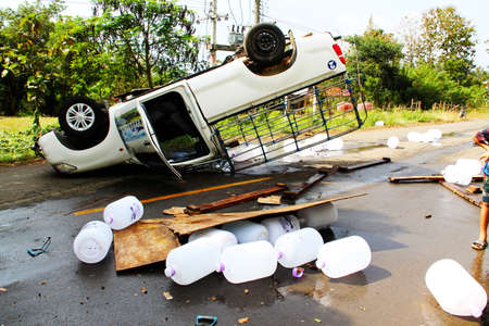 PHETCHABUN, THAILAND - NOVEMBER 24 : Car accident on the road with turned upside-down after road collision november 24,2012 in phetchabun thailand.のeditorial素材