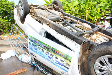 PHETCHABUN, THAILAND - NOVEMBER 24 : Car accident on the road with turned upside-down after road collision november 24,2012 in phetchabun thailand.のeditorial素材