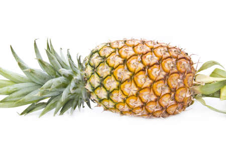 ripe pineapple isolated on white の写真素材