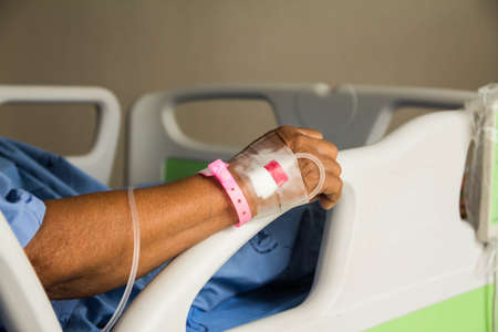 Sick patient lying on bed in hospital for medicalの写真素材
