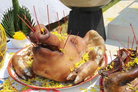 Boiled pig head for sacrifice and vowの写真素材