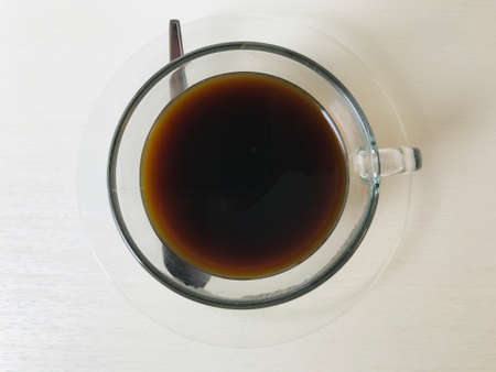 Close-up of coffee cup and tea cup on a table in cafeの写真素材