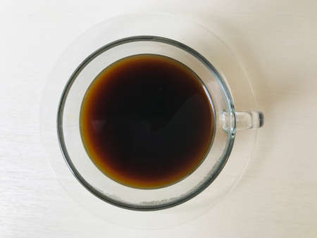 Close-up of coffee cup and tea cup on a table in cafeの写真素材