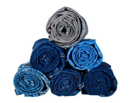 Lot of different jeans isolated on white backgroundの写真素材