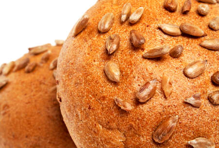 Sandwich bun with sunflower seeds isolated on white background, closeupの写真素材