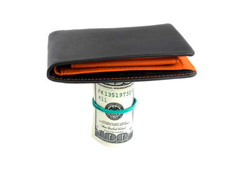 Black leather wallet and dollars on white background