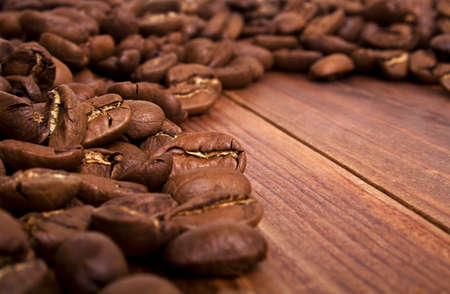 Coffee beans on wood backgroundの写真素材