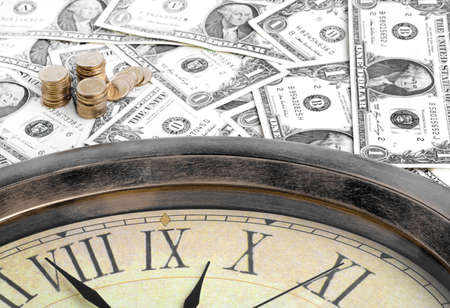 old clock and moneyの写真素材