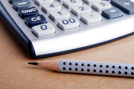 The calculator and pencilの写真素材